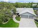 Aerial shot of the home shows mature landscaping and a two-car garage at 3342 Waterford Dr, Clearwater, FL 33761
