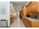 Spacious kitchen featuring wood cabinets, granite countertops, tile backsplash, and stainless steel appliances at 3342 Waterford Dr, Clearwater, FL 33761