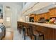 Kitchen open to living room features a breakfast bar with seating and pendant lighting at 3342 Waterford Dr, Clearwater, FL 33761