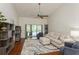 Inviting living room with a vaulted ceiling, comfortable seating, and sliding doors to the outdoor area at 3342 Waterford Dr, Clearwater, FL 33761