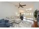 Open-concept living room with vaulted ceilings, stylish furnishings, and easy access to the dining area at 3342 Waterford Dr, Clearwater, FL 33761