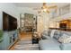 Cozy living room is open to the kitchen and features hardwood floors and stone fireplace at 3342 Waterford Dr, Clearwater, FL 33761
