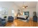 Serene main bedroom with vaulted ceilings, comfortable seating, and a sliding glass door to the outdoors at 3342 Waterford Dr, Clearwater, FL 33761