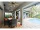 Inviting outdoor seating area with a view of the pool and outdoor bar at 3342 Waterford Dr, Clearwater, FL 33761