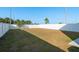 Large fenced-in backyard with grass, offering privacy and space at 34847 Daisy Meadow Loop, Zephyrhills, FL 33541