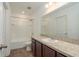 Bathroom featuring a vanity with a sink, a toilet, and a shower-tub combo at 34847 Daisy Meadow Loop, Zephyrhills, FL 33541
