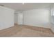 Empty bedroom with carpet flooring and white walls at 34847 Daisy Meadow Loop, Zephyrhills, FL 33541