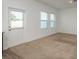 Bright dining area featuring a door to the back and large windows that add natural light and views at 34847 Daisy Meadow Loop, Zephyrhills, FL 33541