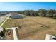 An aerial view of the dog park with separate fenced areas for large and small breeds at 34847 Daisy Meadow Loop, Zephyrhills, FL 33541