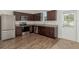 Modern kitchen with stainless steel appliances and granite countertops providing a premium aesthetic at 34847 Daisy Meadow Loop, Zephyrhills, FL 33541