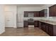 Modern kitchen featuring stainless steel appliances and granite countertops at 34847 Daisy Meadow Loop, Zephyrhills, FL 33541