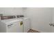 Laundry room with a white washer and dryer at 34847 Daisy Meadow Loop, Zephyrhills, FL 33541