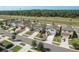Aerial view of a well-planned residential neighborhood with modern homes and green spaces at 34847 Daisy Meadow Loop, Zephyrhills, FL 33541