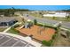 Community playground with slides, climbing wall, and swing set, surrounded by lush landscaping at 34847 Daisy Meadow Loop, Zephyrhills, FL 33541