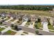 An aerial view of several homes in the neighborhood, showcasing sidewalks and greenery at 34855 Daisy Meadow Loop, Zephyrhills, FL 33541