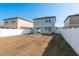 The house features a spacious backyard with a patio at 34855 Daisy Meadow Loop, Zephyrhills, FL 33541