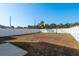 Expansive backyard enclosed with a white privacy fence, great for outdoor activities at 34855 Daisy Meadow Loop, Zephyrhills, FL 33541