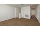 The upstairs loft area has neutral walls, plush carpeting and a door at 34855 Daisy Meadow Loop, Zephyrhills, FL 33541