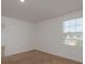 Cozy bedroom with a window and neutral paint providing a relaxing ambiance at 34866 Daisy Meadow Loop, Zephyrhills, FL 33541