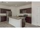 Beautiful kitchen with stainless steel appliances, granite countertops, and an island with a sink at 34866 Daisy Meadow Loop, Zephyrhills, FL 33541