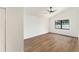 Spacious bedroom with a high ceiling, a fan, wood flooring and a bright window at 3707 Orangepointe Rd, Valrico, FL 33596