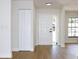 Bright entryway featuring white doors and light wood floors, offering a welcoming introduction to the home at 3707 Orangepointe Rd, Valrico, FL 33596