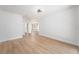 Spacious living room featuring hardwood floors and a large window at 3707 Orangepointe Rd, Valrico, FL 33596