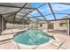Inviting screened-in pool with a tiled patio, ideal for enjoying sunny days and relaxation at 3707 Orangepointe Rd, Valrico, FL 33596