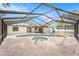 Large screened-in pool and spa with spacious patio area, offering a luxurious outdoor experience at 3707 Orangepointe Rd, Valrico, FL 33596