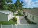 An aerial view captures the backyard with a spacious detached garage and screened-in porch at 4101 Brooke Dr, Valrico, FL 33594