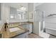 Bathroom featuring granite counters, grey cabinetry, and a walk-in shower at 4101 Brooke Dr, Valrico, FL 33594
