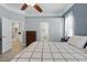Bedroom with ensuite bathroom and kitchen view, complete with wood floors at 4101 Brooke Dr, Valrico, FL 33594