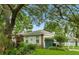 A charming single-story home shows lush landscaping and a beautiful yard at 4101 Brooke Dr, Valrico, FL 33594