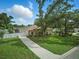 Well-maintained property with green lawn, mature trees, and a privacy fence at 4101 Brooke Dr, Valrico, FL 33594