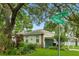 Charming single story home with lush landscaping, a green lawn and beautiful mature trees at 4101 Brooke Dr, Valrico, FL 33594