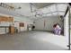 Spacious garage with work area, pegboard, cabinets, overhead storage, and an automatic door opener at 4101 Brooke Dr, Valrico, FL 33594