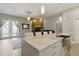 The kitchen's light countertops and stainless steel sink provides views of the backyard pool through french doors at 4101 Brooke Dr, Valrico, FL 33594