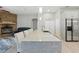 Open kitchen featuring a large island with seating, modern lighting, and stainless steel appliances at 4101 Brooke Dr, Valrico, FL 33594