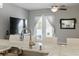 The kitchen features a stainless steel sink, light countertops, and views through french doors to the backyard pool at 4101 Brooke Dr, Valrico, FL 33594