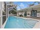 A gorgeous screened-in pool features convenient access to the home and lovely patio space at 4101 Brooke Dr, Valrico, FL 33594