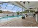A beautiful view of the screened-in pool and outdoor living area at 4101 Brooke Dr, Valrico, FL 33594