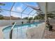 The screened-in pool boasts a sleek design and inviting atmosphere for relaxation at 4101 Brooke Dr, Valrico, FL 33594