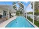 A refreshing screened-in pool features a spacious deck and charming landscaping at 4101 Brooke Dr, Valrico, FL 33594