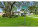 A lovely home on a tree-lined street corner, with well-maintained landscaping at 4101 Brooke Dr, Valrico, FL 33594
