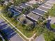Aerial view of a neighborhood showcasing similar homes, landscaping, and street layout at 441 Thicket Crest Rd, Seffner, FL 33584