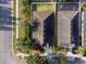 Aerial view of a home, showcasing the layout, fenced backyard, and proximity to neighborhood pool at 441 Thicket Crest Rd, Seffner, FL 33584