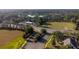Aerial view of a neighborhood, showcasing homes, streets, and surrounding green spaces at 441 Thicket Crest Rd, Seffner, FL 33584