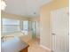 Bright bathroom featuring a garden tub, a glass-enclosed shower, and neutral tile flooring at 441 Thicket Crest Rd, Seffner, FL 33584