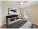 Comfortable bedroom with an accent wall, a large window, and new vinyl flooring at 441 Thicket Crest Rd, Seffner, FL 33584