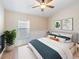 Inviting bedroom with lots of natural light, fresh white bedding, and a relaxing atmosphere at 441 Thicket Crest Rd, Seffner, FL 33584